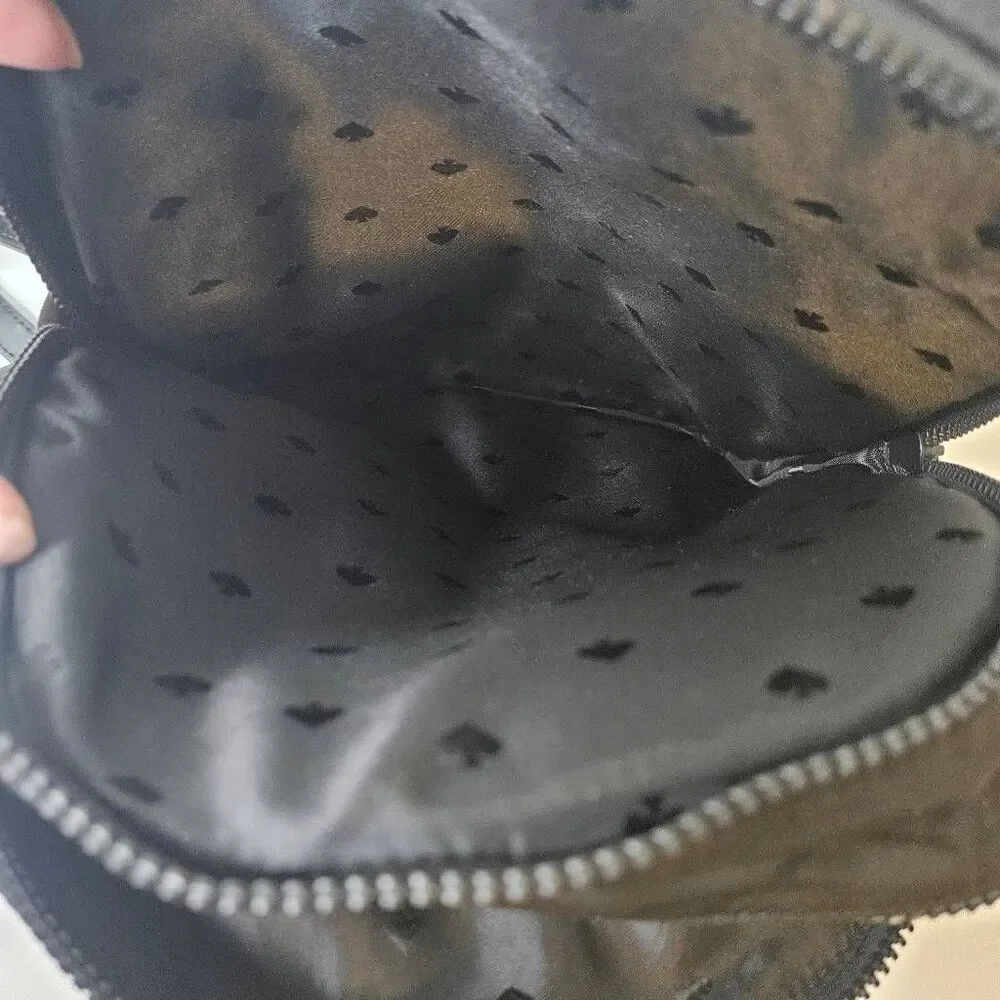 Kate Spade Karissa black nylon backpack, minimalist design.